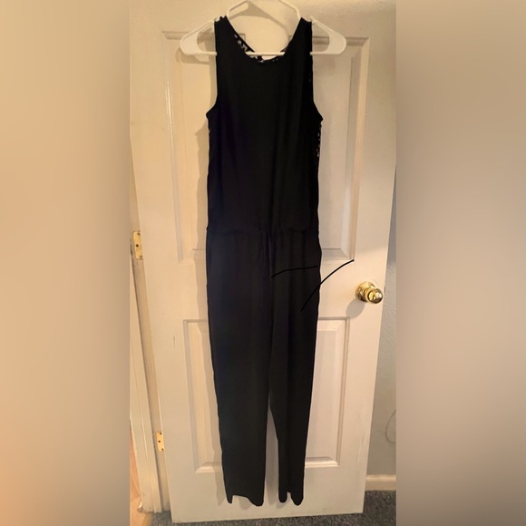 Sexy & Sophisticated BCBGMaxAzria Black Lace Detail Jumpsuit with Pockets - Picture 3 of 10